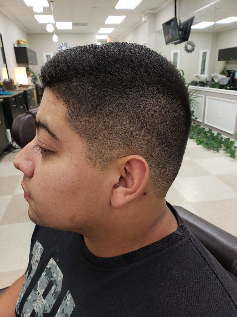 A high skin fade blended cleanly above the ear.