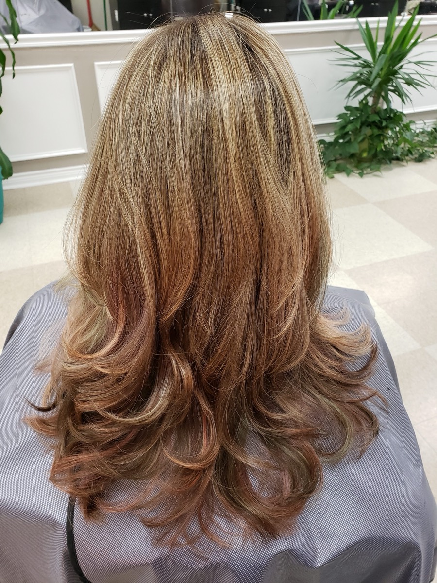 A long layered blow-dry with soft curled ends.