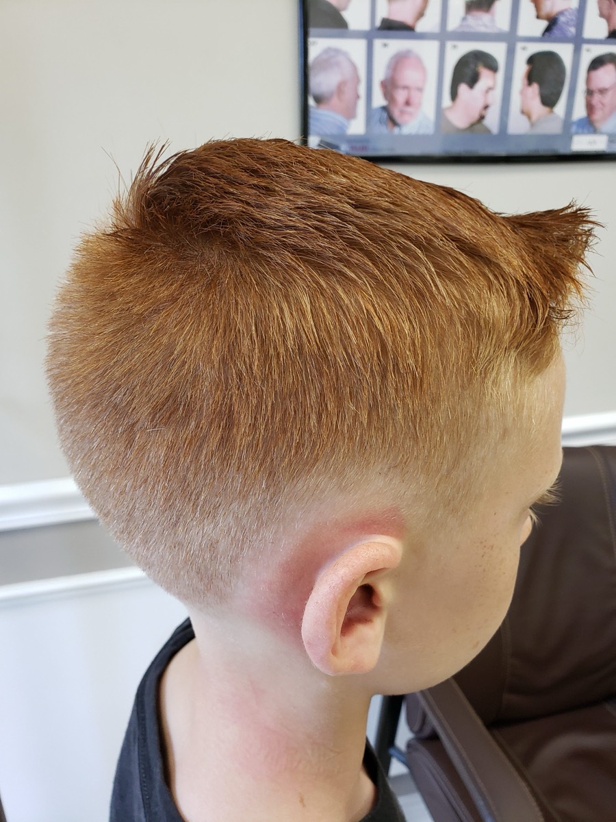 A boy's textured crop, tapered short at the neck.